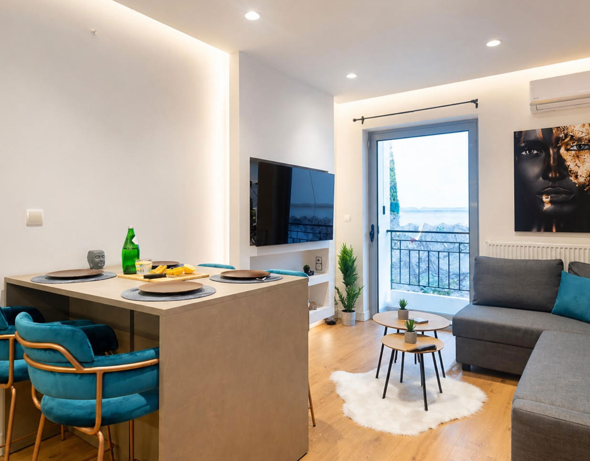 Living room with sofa, kitchen island seating, and balcony access, Nea Filothei, Athens, Greece