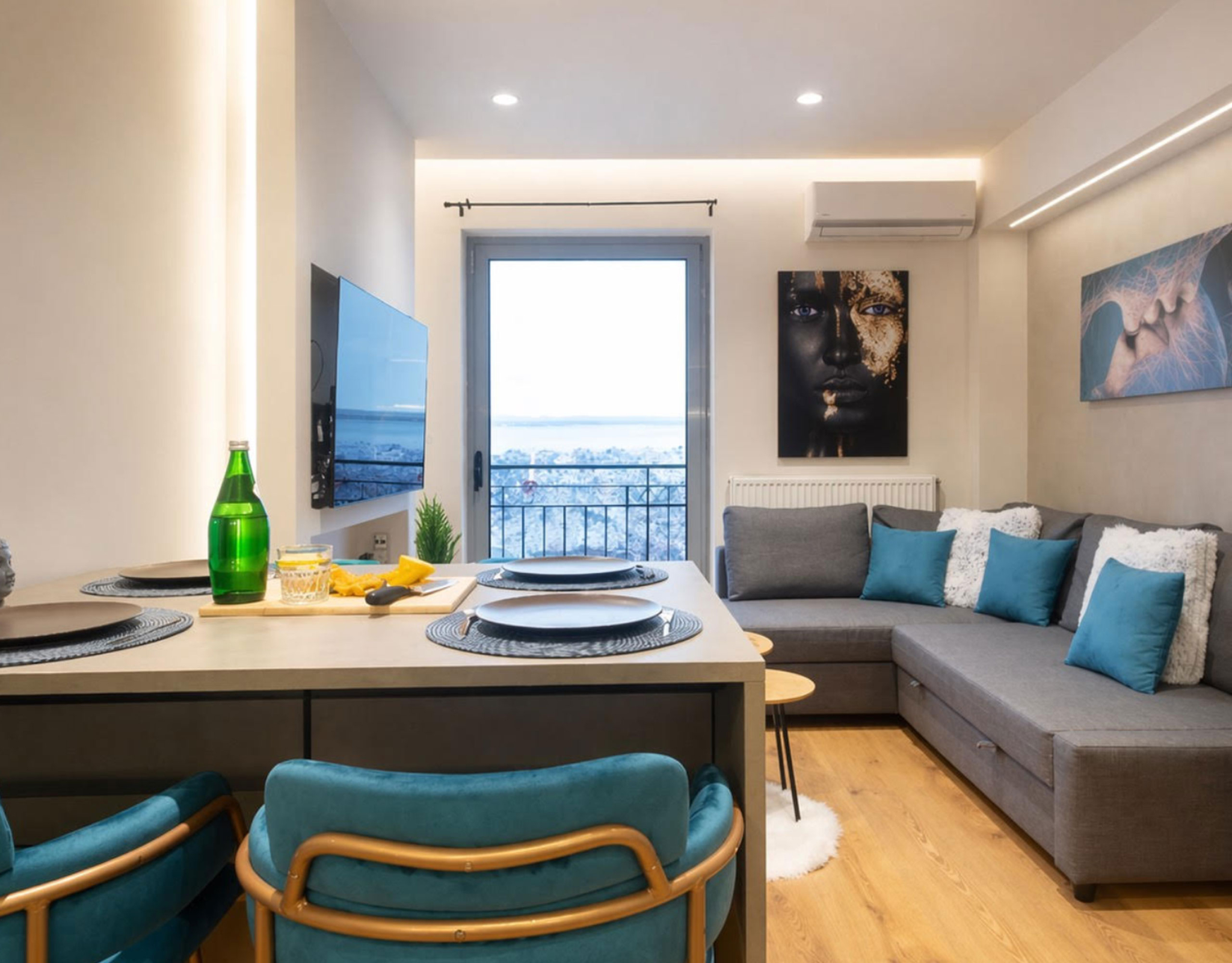 Open-plan living and dining area with kitchen island and balcony door, Nea Filothei, Athens, Greece
