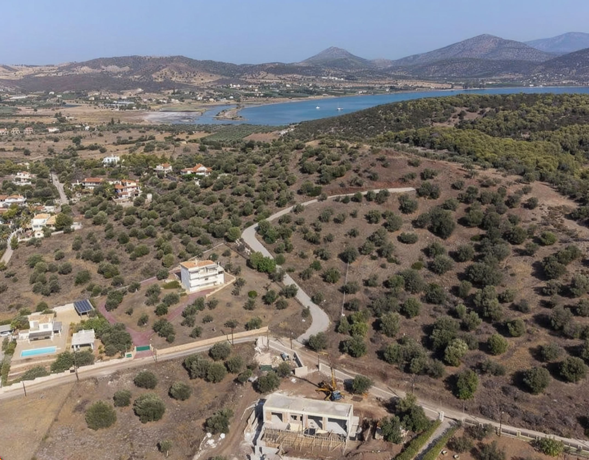 Ermioni Seaview Land Plot – Drone View With Road And Sea Drone view of the land plot area with road access and sea in the distance, Ermioni, Greece