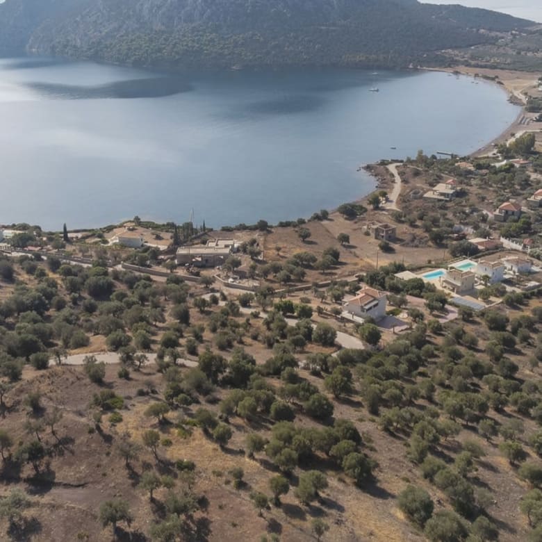 Aerial view of a coastal bay and surrounding landscape, Ermioni, Greece