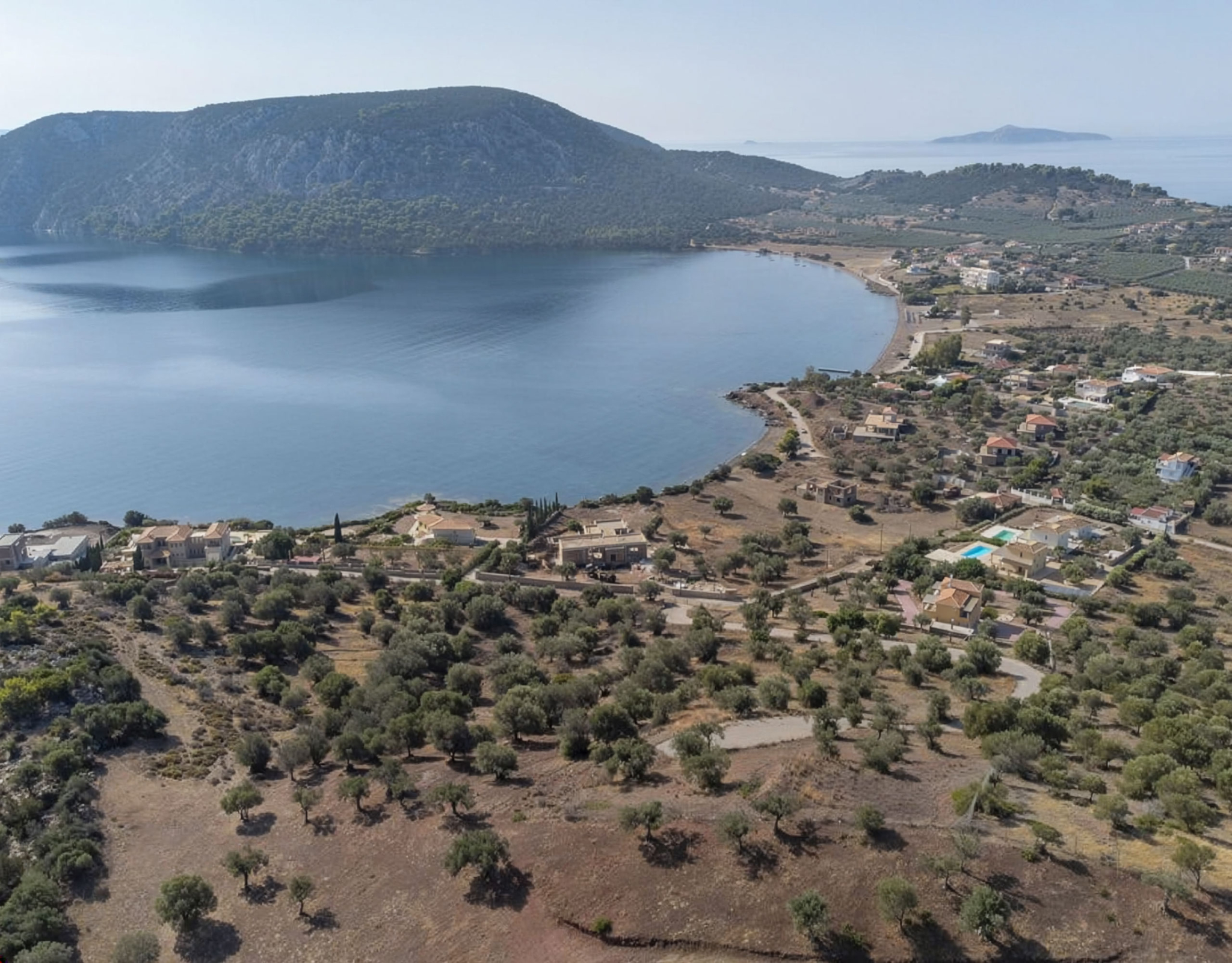 Ermioni Seaview Land Plot – Drone View Of Coastline And Bay Drone view of the coastline and bay with open sea views, Ermioni, Greece