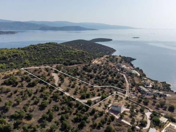 Aerial view of the coastline with hills and open sea, Ermioni, Greece