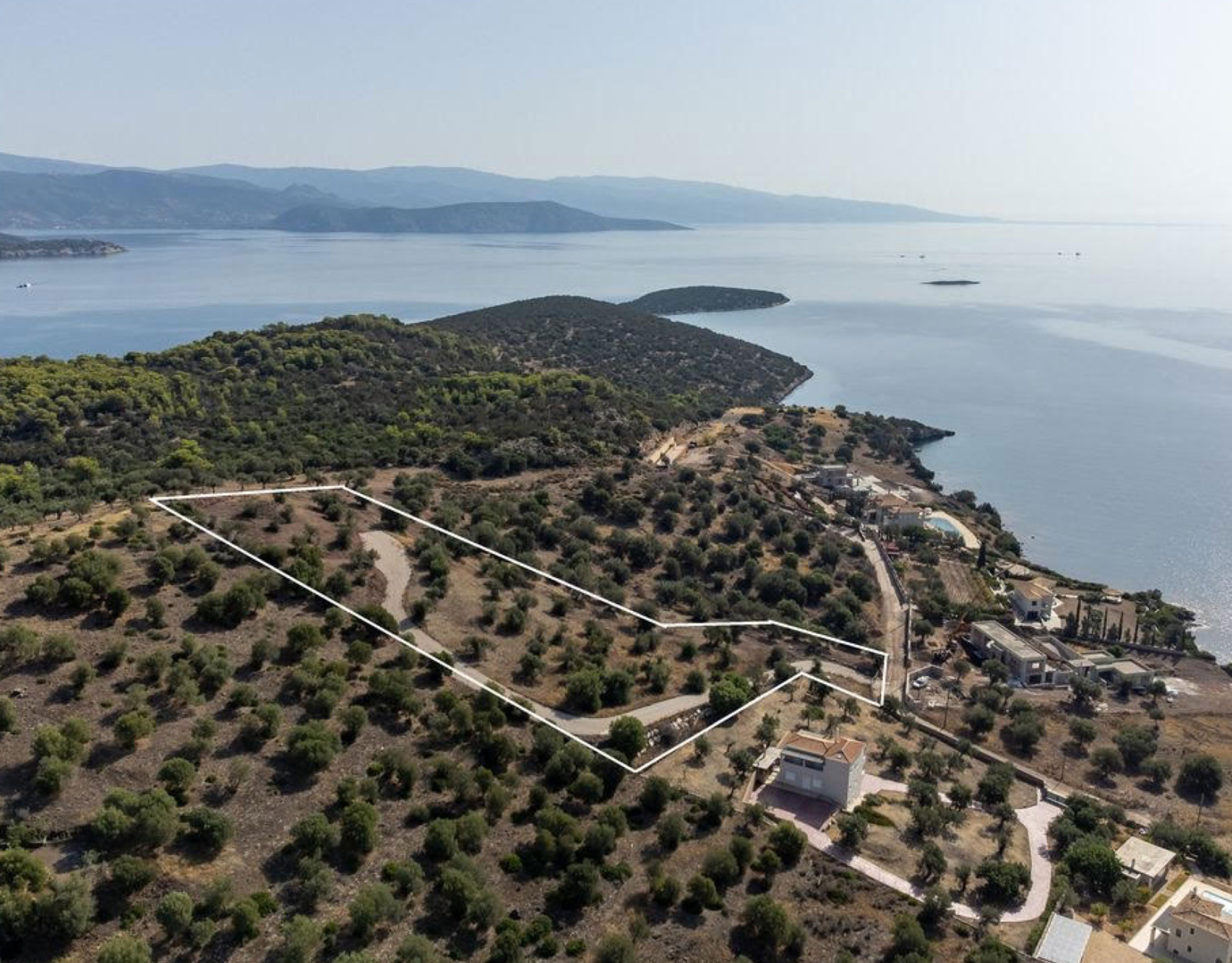 Ermioni Seaview Land Plot – Aerial Coastline And Sea View Aerial view of the coastline with hills and open sea, Ermioni, Greece