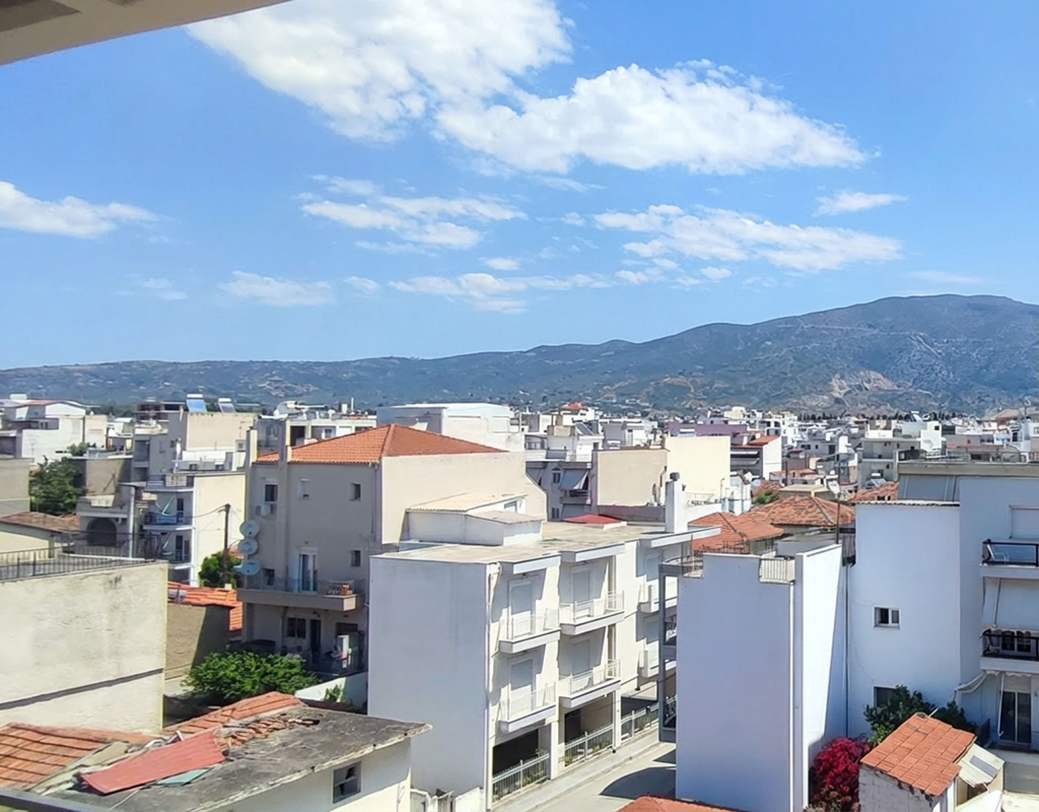 Balcony View Towards Volos & Mount Pelion Panoramic city and mountain view from the balcony of a newly built duplex maisonette in Volos
