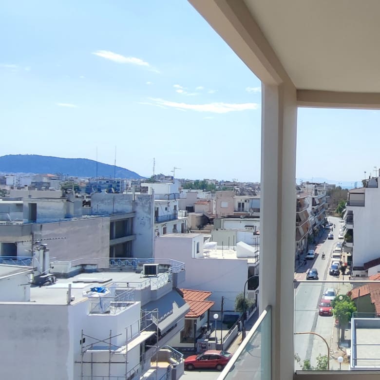 Elevated balcony view over the neighborhood and streets of Volos from a newly built duplex maisonette