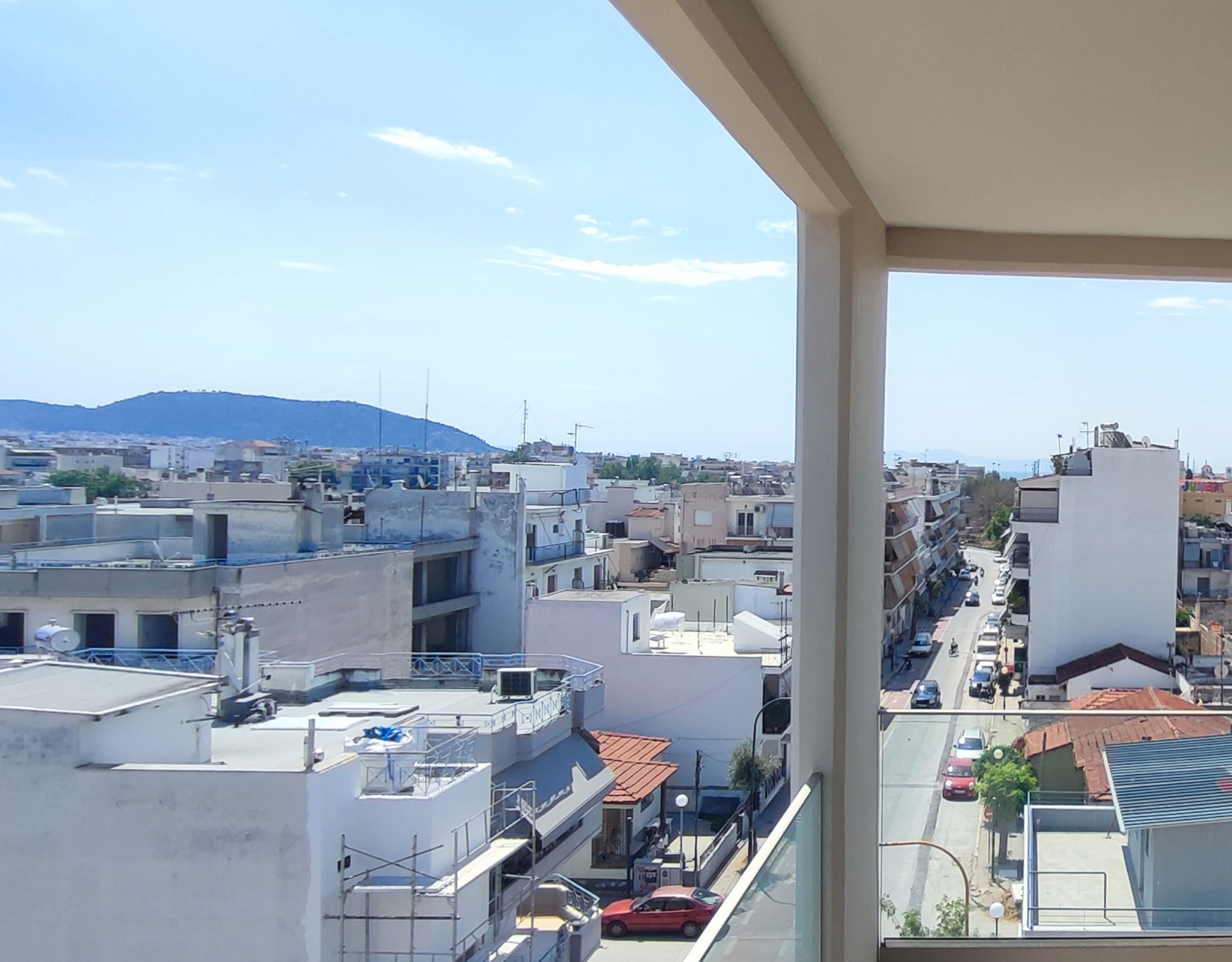 Elevated Balcony View Over the Neighborhood Elevated balcony view over the neighborhood and streets of Volos from a newly built duplex maisonette