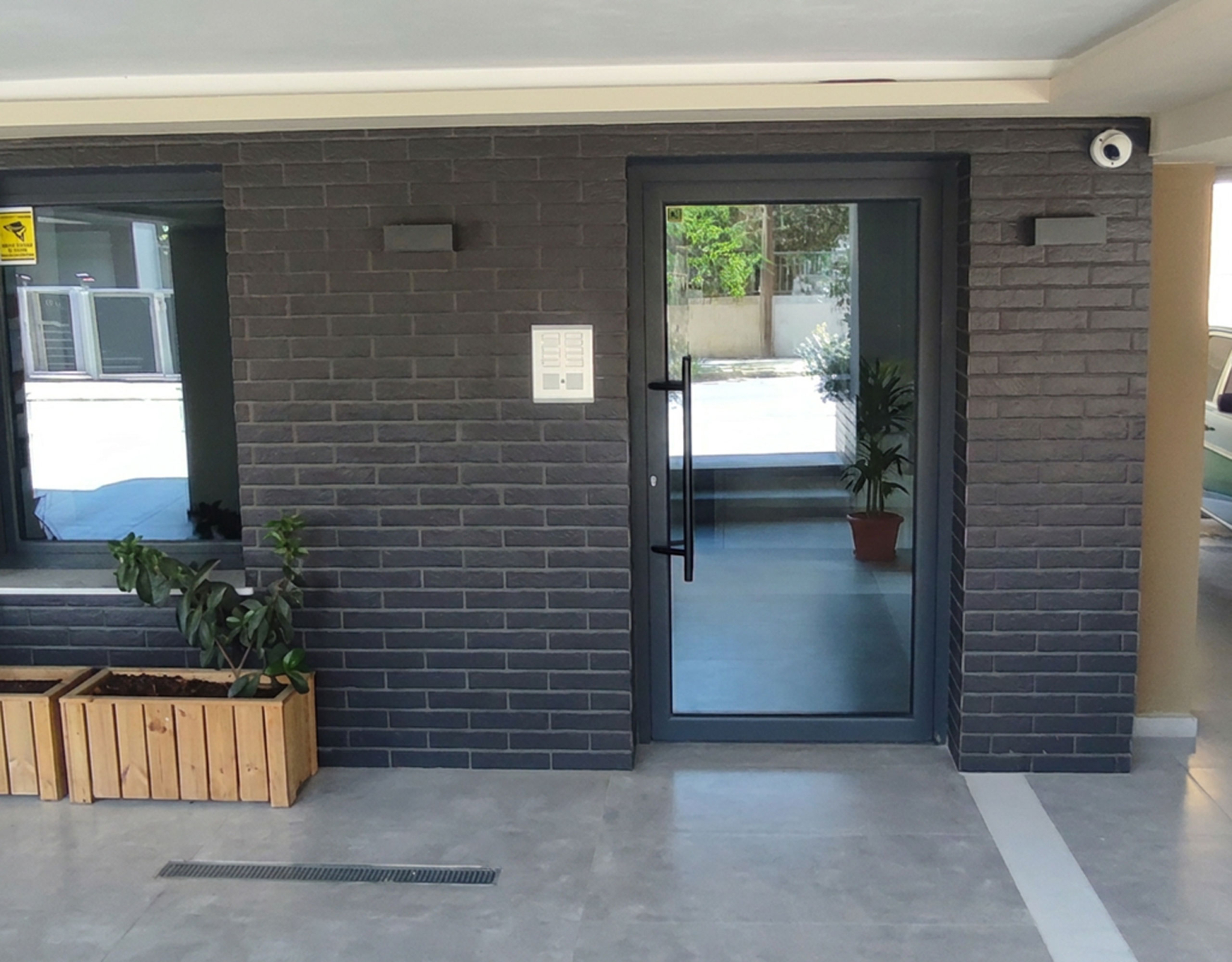 Secure Building Entrance Modern building entrance with secure glass door and contemporary facade