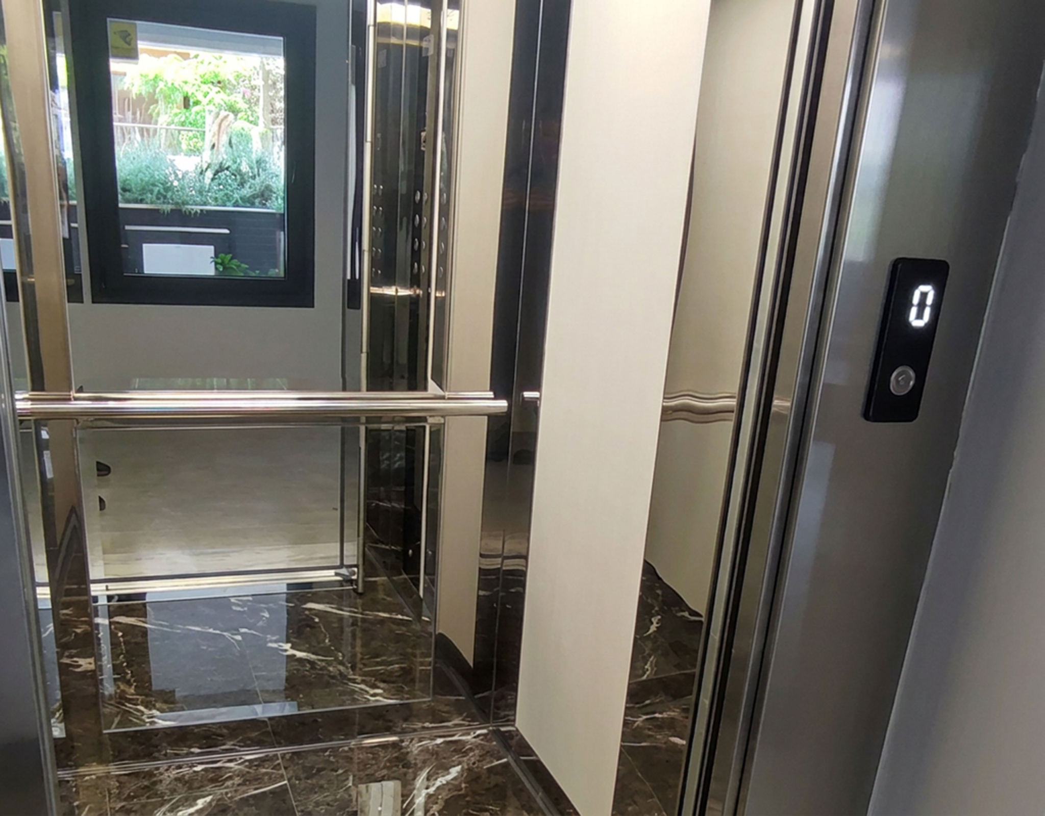 Modern Elevator Cabin Modern elevator cabin with stainless steel details in a newly built residential building