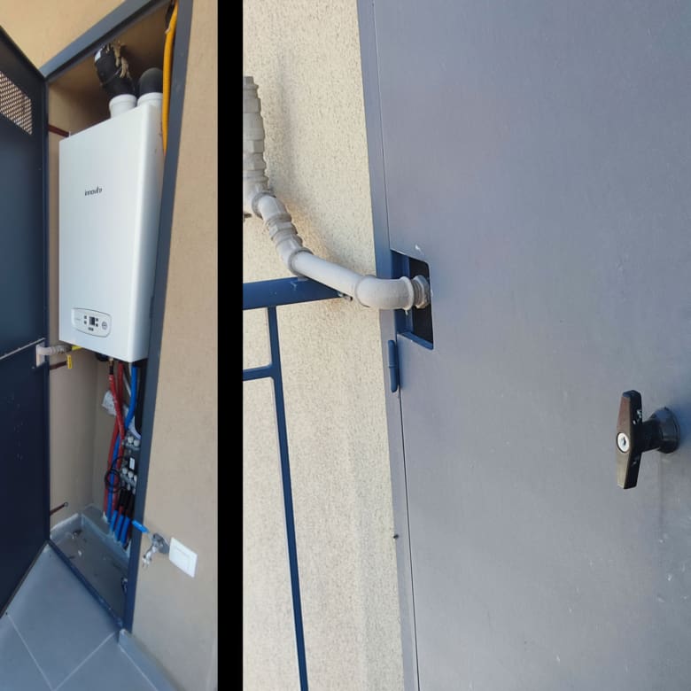 Individual natural gas boiler installed in a protective metal cabinet on the balcony
