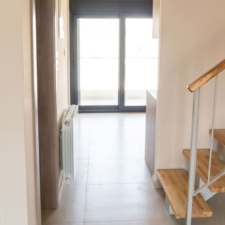 Internal staircase and hallway leading to the balcony in a newly built duplex maisonette in Nea Ionia, Volos