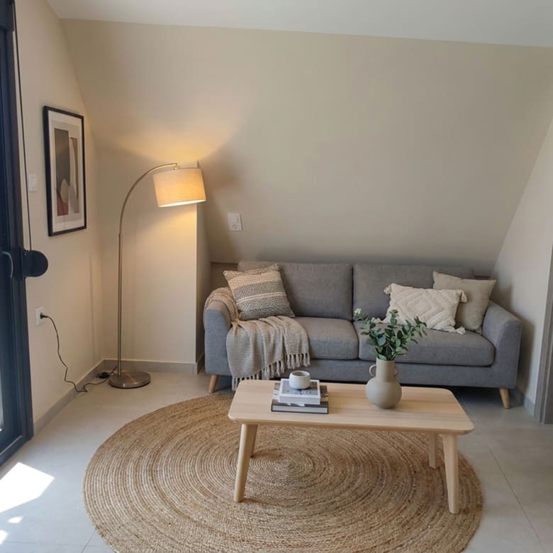 Cozy sitting area with balcony access (virtual staging, indicative layout) Title: Sitting Area with Balcony Access (Virtual Staging)